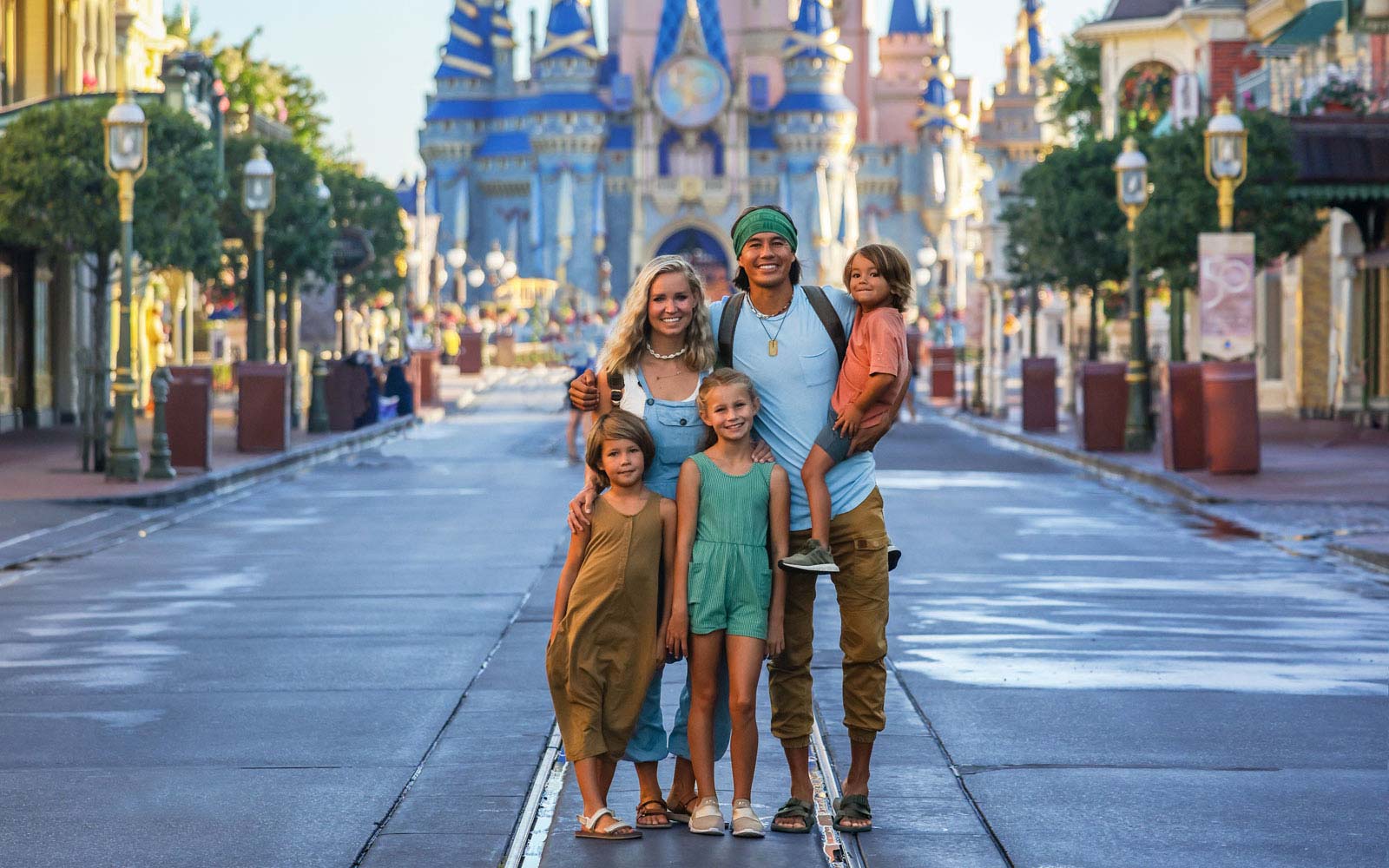image of bucket list family in front of disney world castle